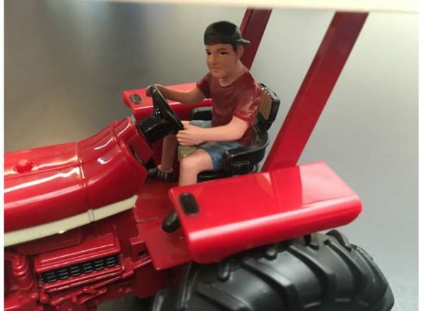ADF32141 - Young man driving tractor - 1