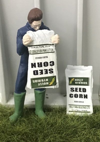 WM078A - Farmer emptying a sack of seeds - 1