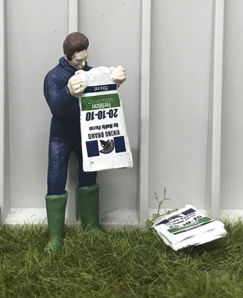 WM078D - Farmer emptying a bag of fertilizer - 1