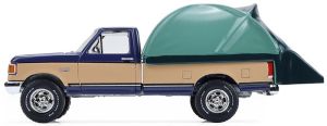 GREEN38080-D - 1987 Ford F-150 XLT Lariat, blue and beige, with a rooftop tent from The Great Outdoors series, still in its original packaging.