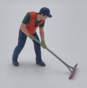 ATLAN32046 - Construction worker with an asphalt scraper