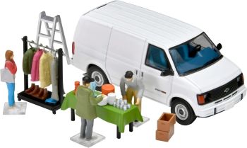 TOM333845 - Flea market with a white Chevrolet Astro van and accessories