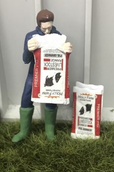 WM078N - Farmer emptying a bag of food for Pigs